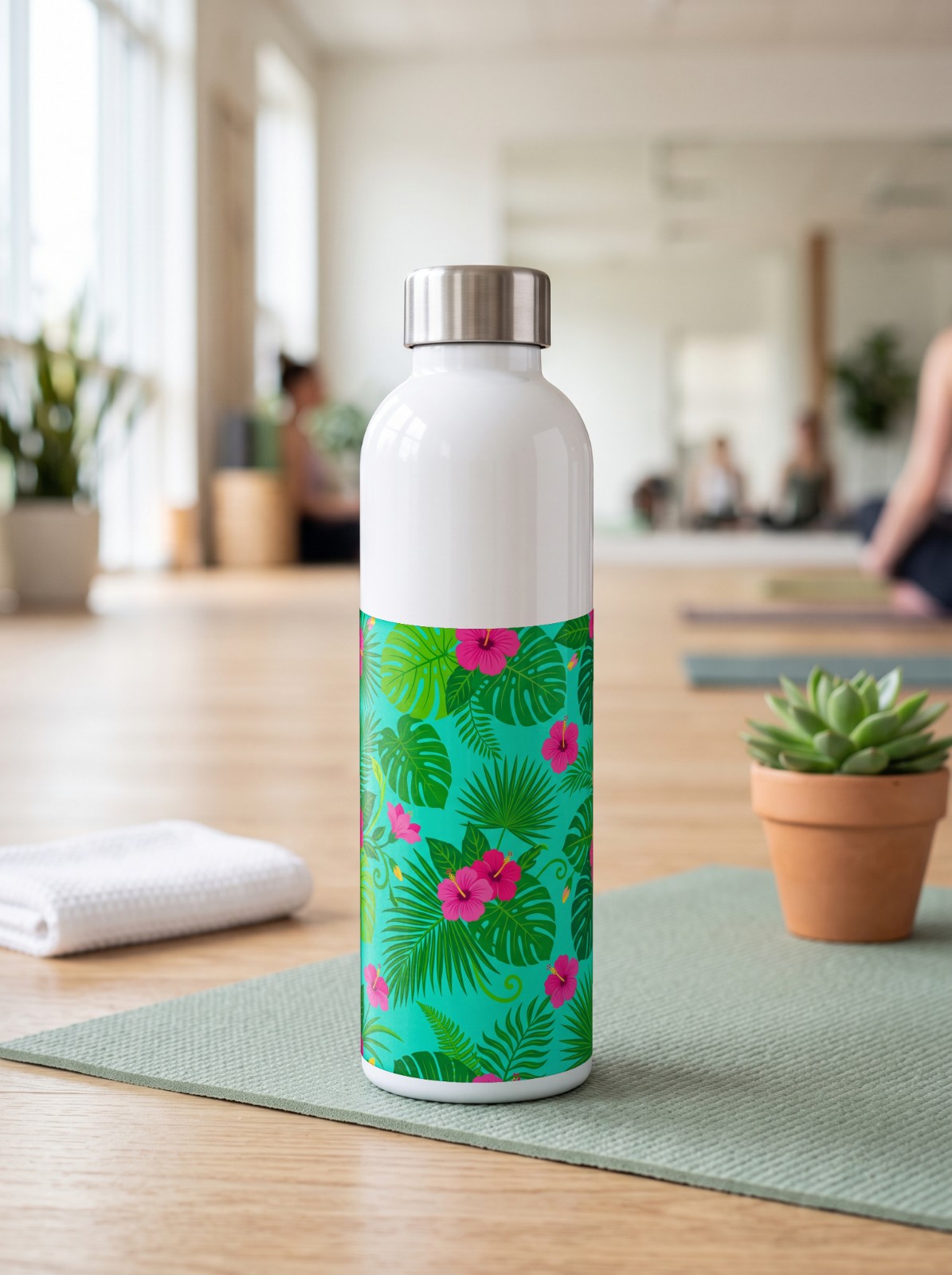 17 oz Water Bottle in a Yoga Studio showing a tropical hibiscus wrap