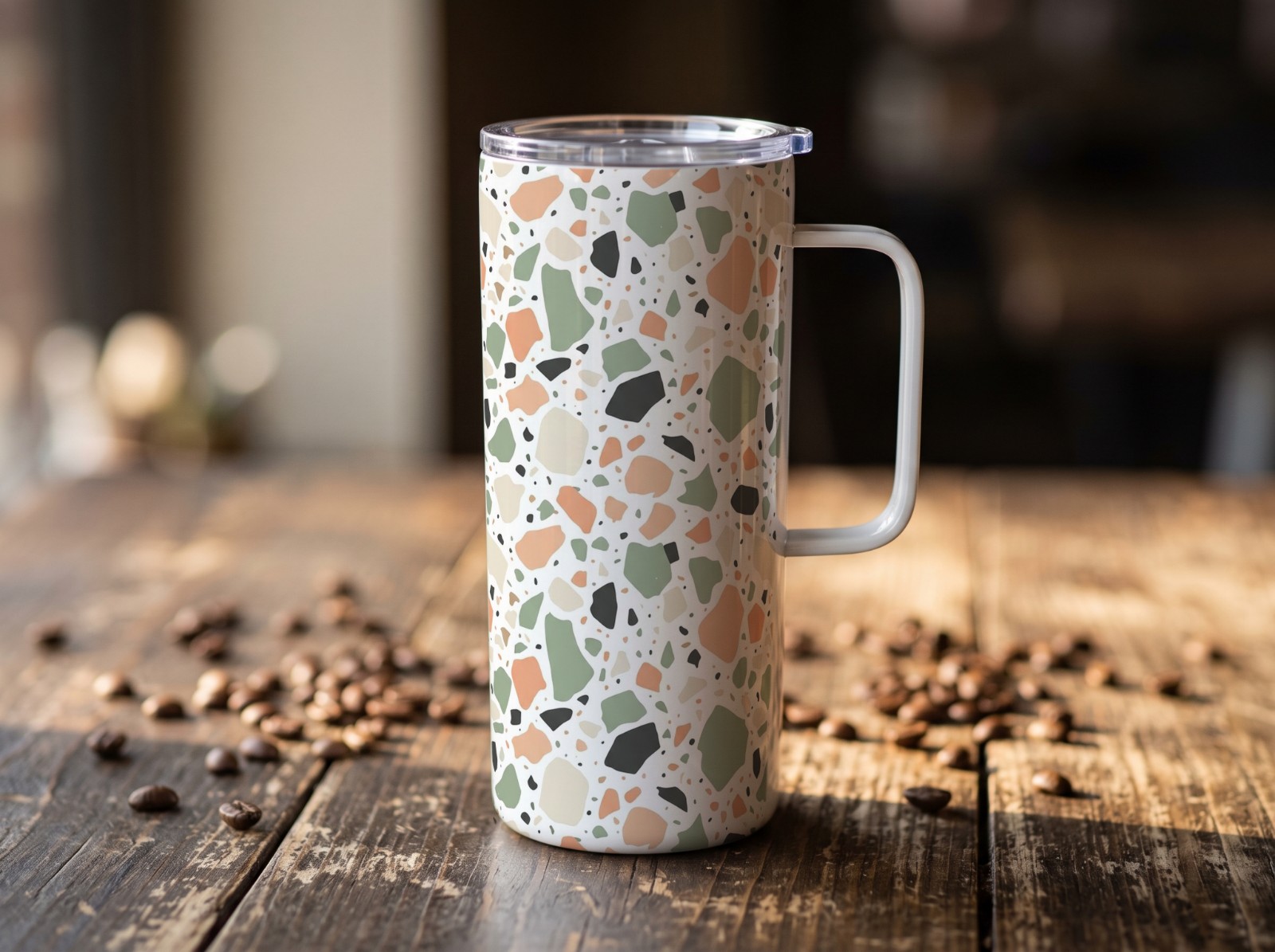 20 oz Mug Tumbler with Handle on a Rustic Cafe Table showing a pastel terrazzo pattern