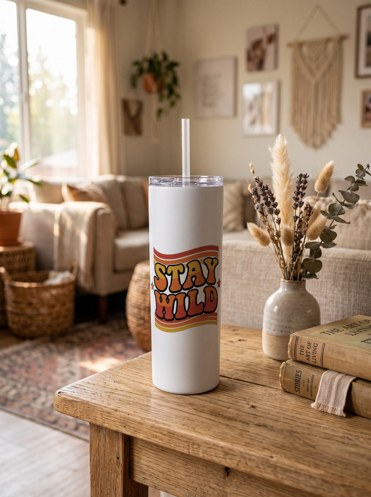 20 oz Skinny Tumbler on a Boho Side Table showing a Stay Wild retro design