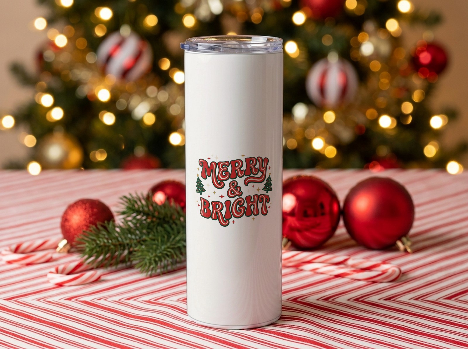 20 oz Skinny Tumbler Christmas on Candy Cane Stripes by the Tree showing a retro Merry & Bright design