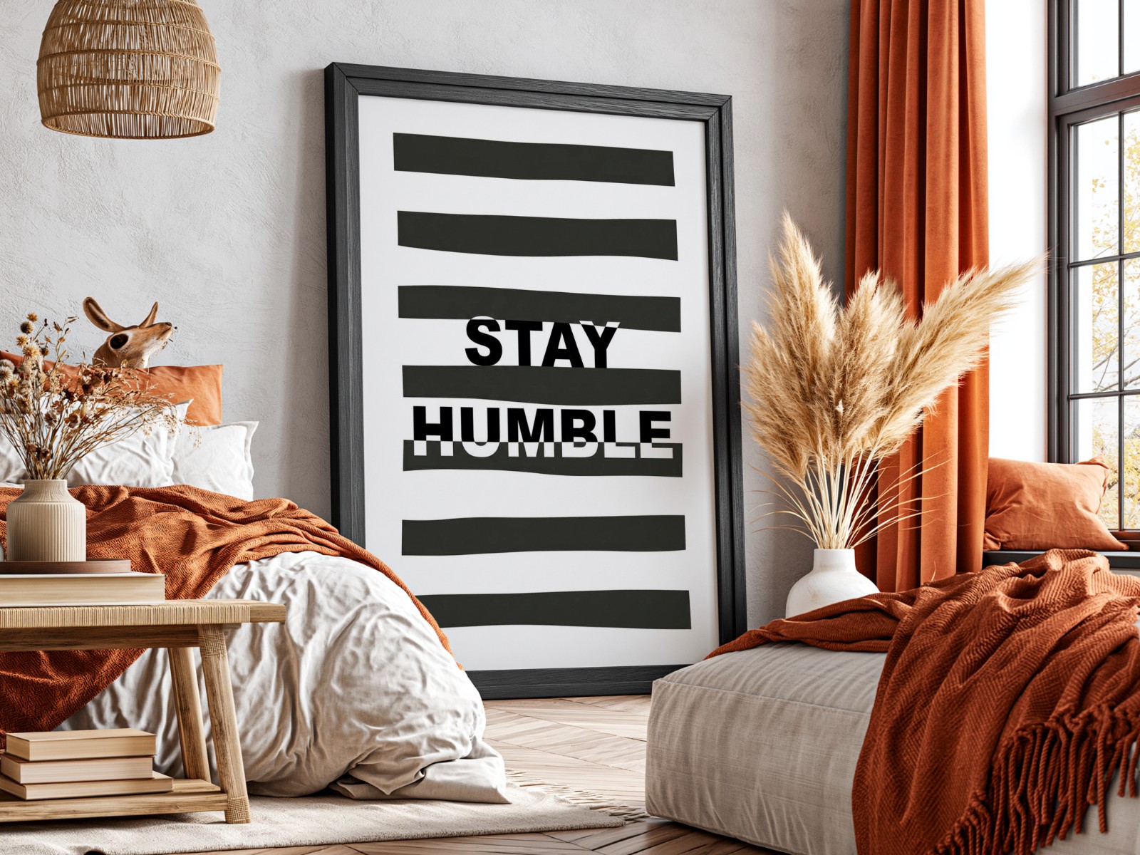 Black Frame Mockup in Boho Bedroom showing a Stay Humble typography print