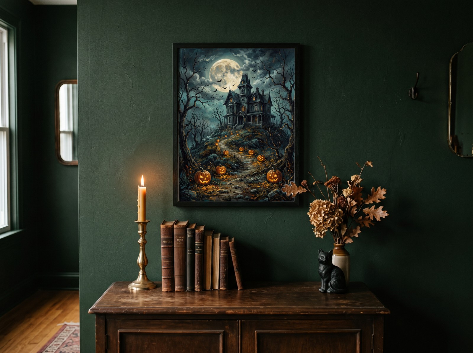 Black Frame Halloween Poster on a Dark Green Dark Academia Wall showing a vintage haunted house painting