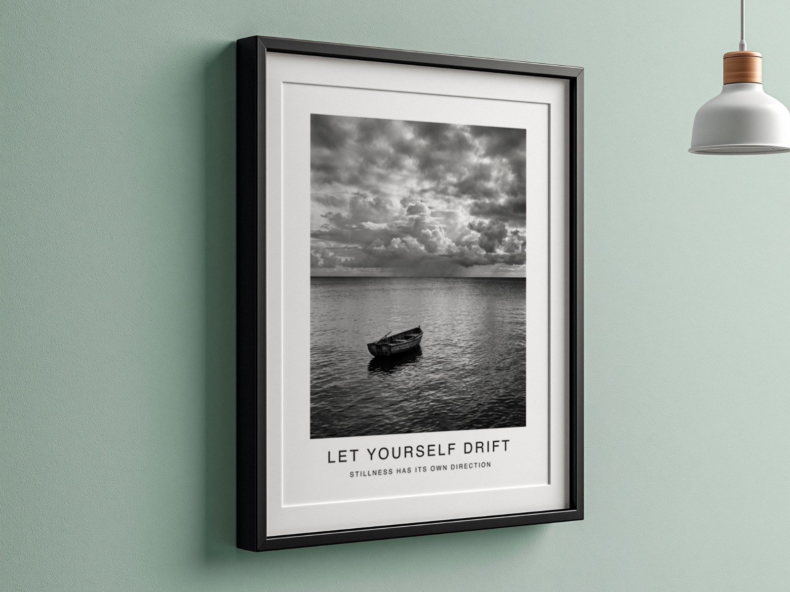 Black Frame with Mat on Sage Green Wall showing a black and white seascape print
