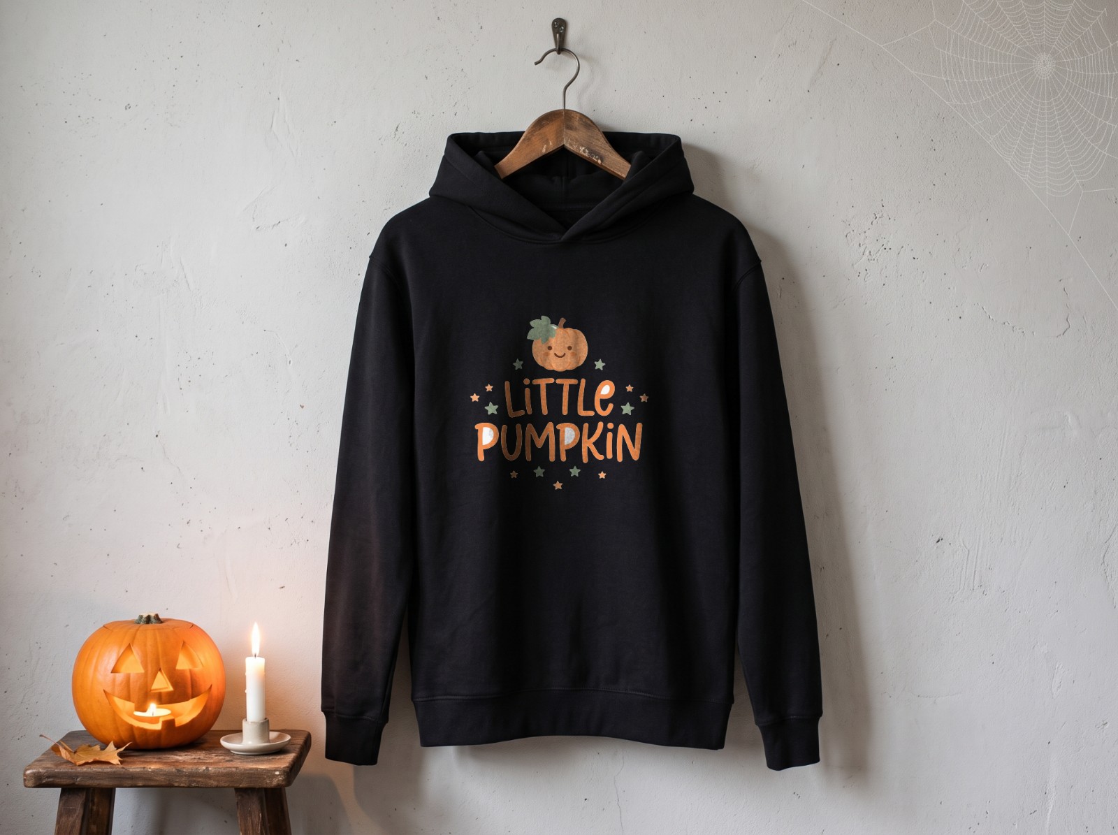 Black Hoodie Halloween on a Hanger with Cobweb and Jack-o'-Lantern showing a cute Little Pumpkin design