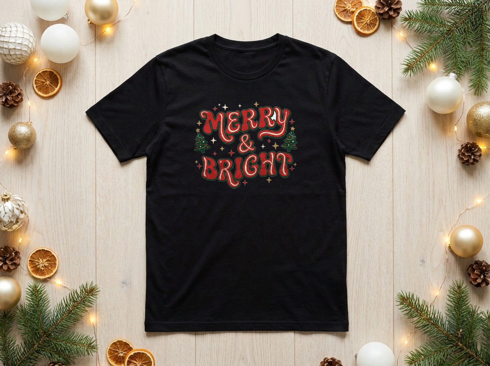 Black T-Shirt Christmas Mockup Flat Lay with Gold Baubles and Dried Oranges example