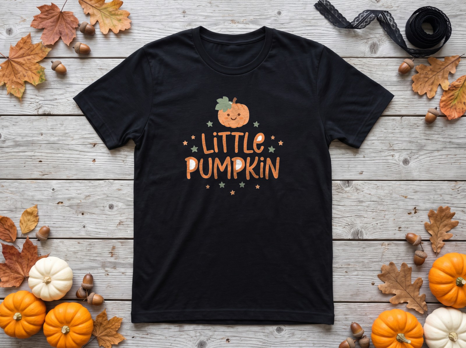 Black T-Shirt Halloween Flat Lay with White Pumpkins and Leaves showing a cute Little Pumpkin design
