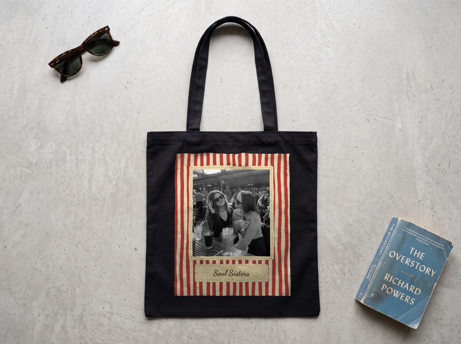 Black Tote Bag Flat Lay on Concrete showing a retro Soul Sisters photo print