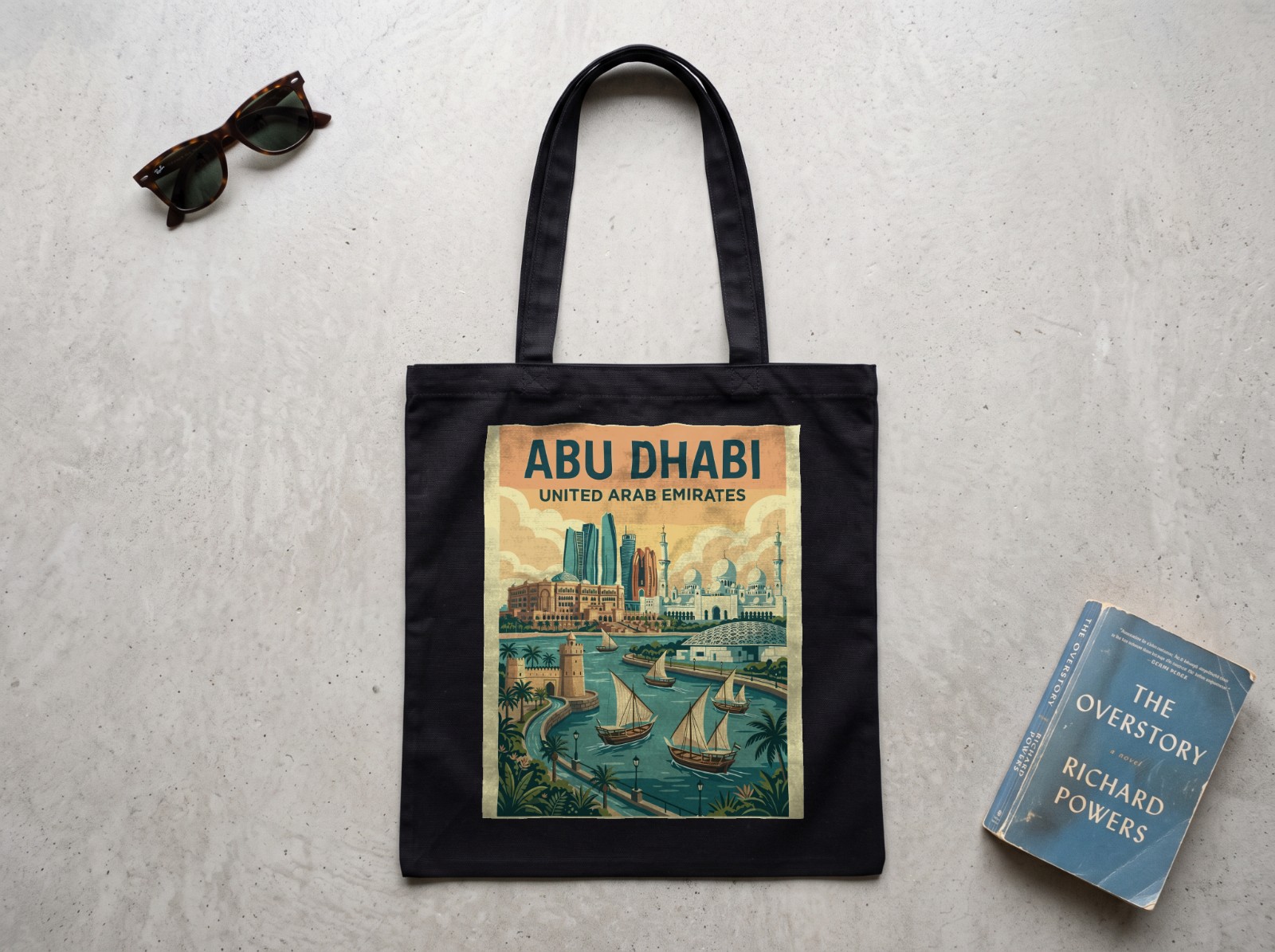 Black Tote Bag Flat Lay on Concrete showing an Abu Dhabi travel print