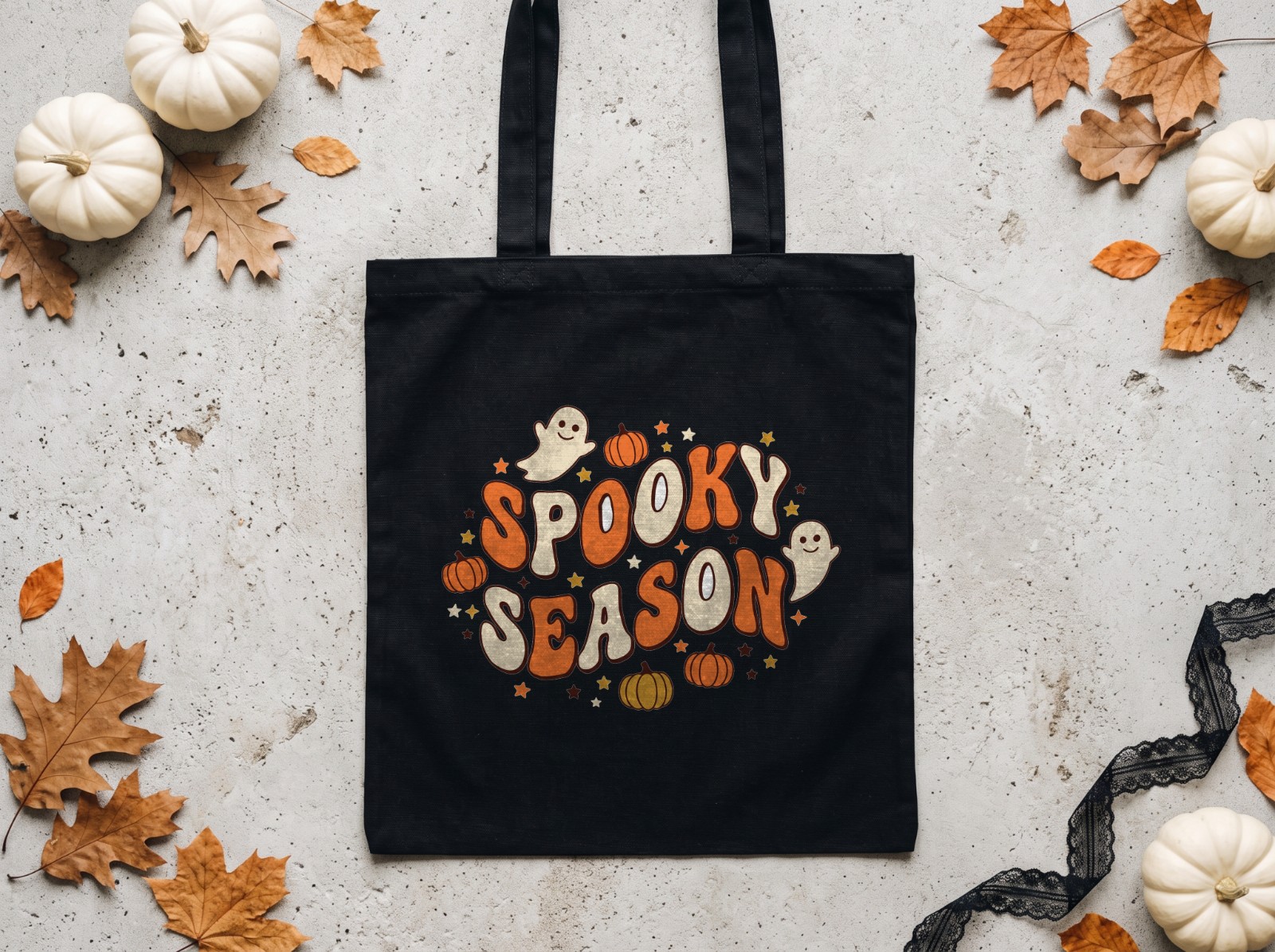 Black Tote Bag Halloween Mockup Flat Lay with White Pumpkins example