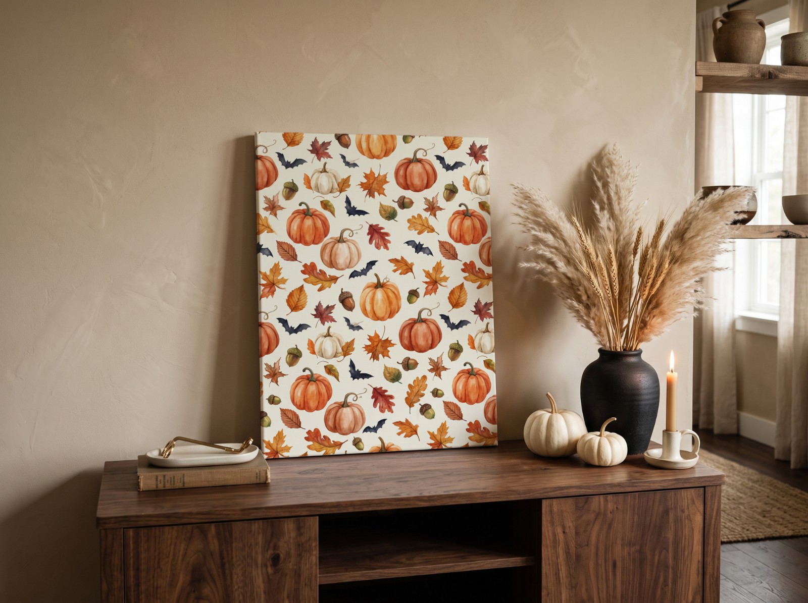 Canvas Print Halloween on a Sideboard with Pampas and a Black Vase showing a watercolour pumpkin and autumn leaf pattern
