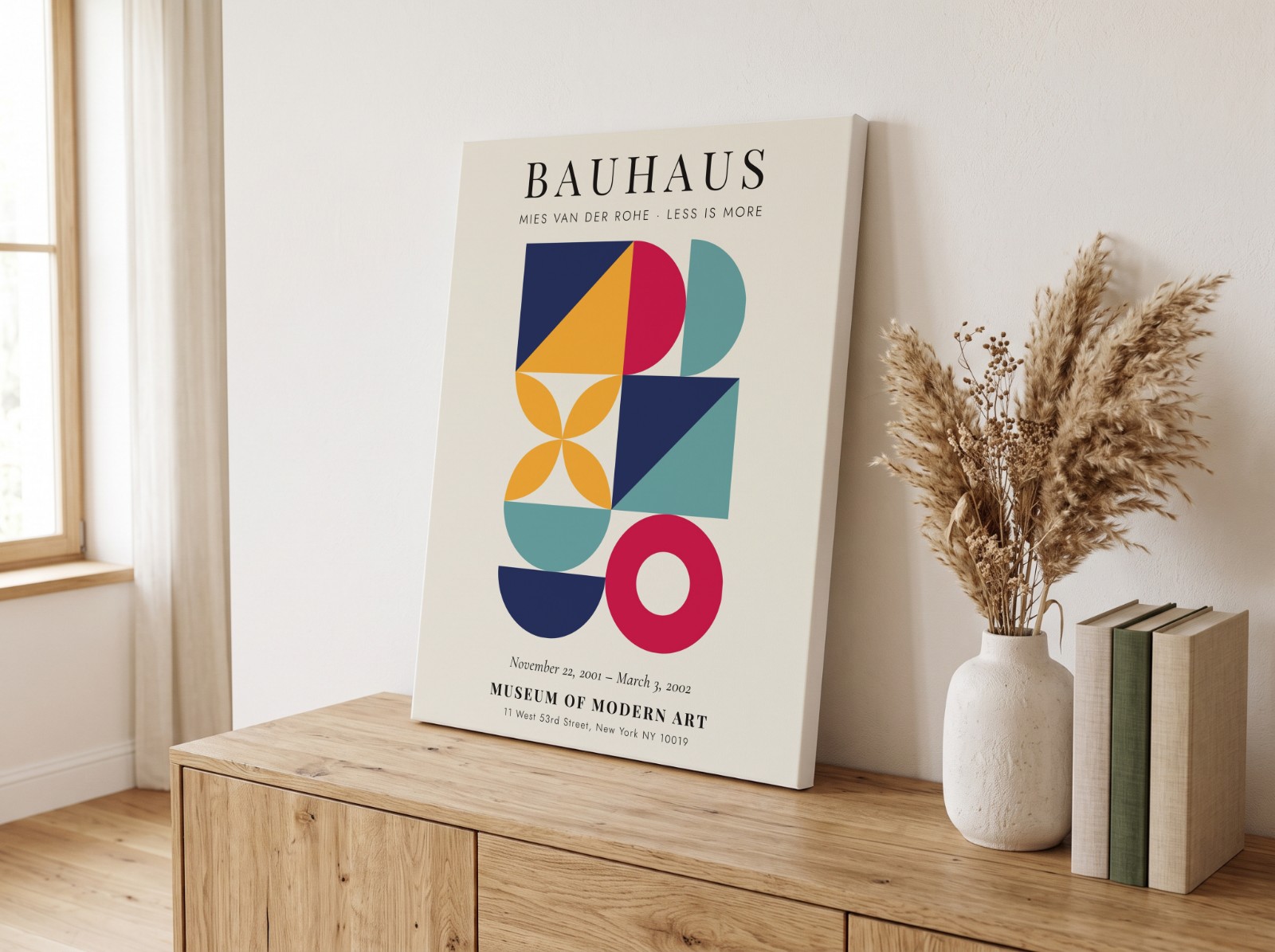 Canvas Print Leaning on an Oak Sideboard showing a Bauhaus Less is More print