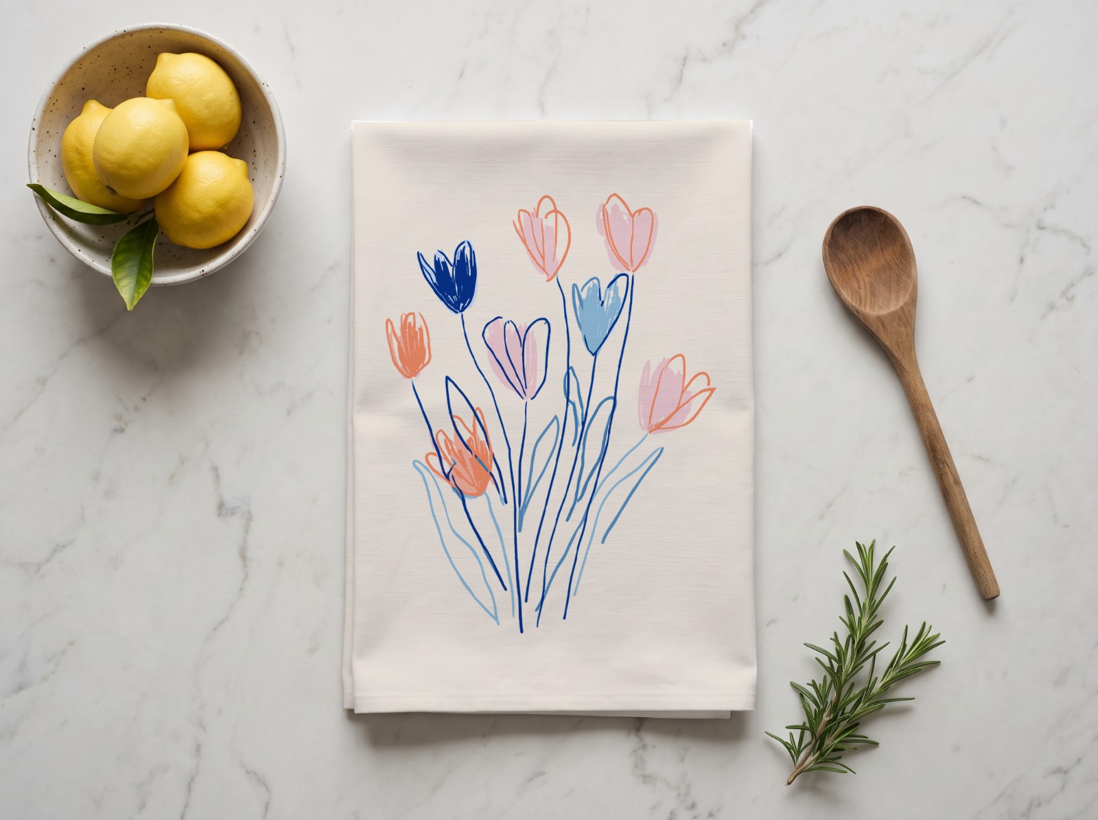Folded Tea Towel on a Marble Counter with Lemons showing the hand-drawn Flowers artwork