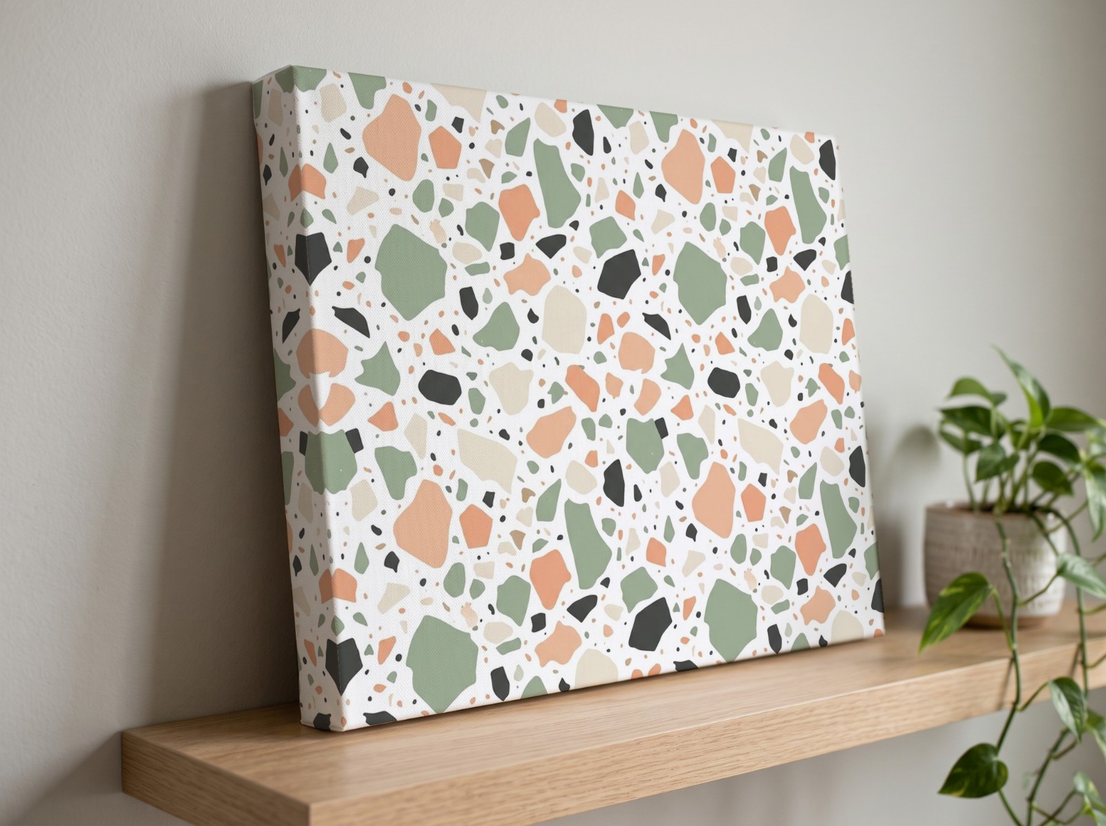 Gallery Wrap Canvas with a 1.25" Mirror Edge on an Oak Shelf showing a pastel terrazzo pattern