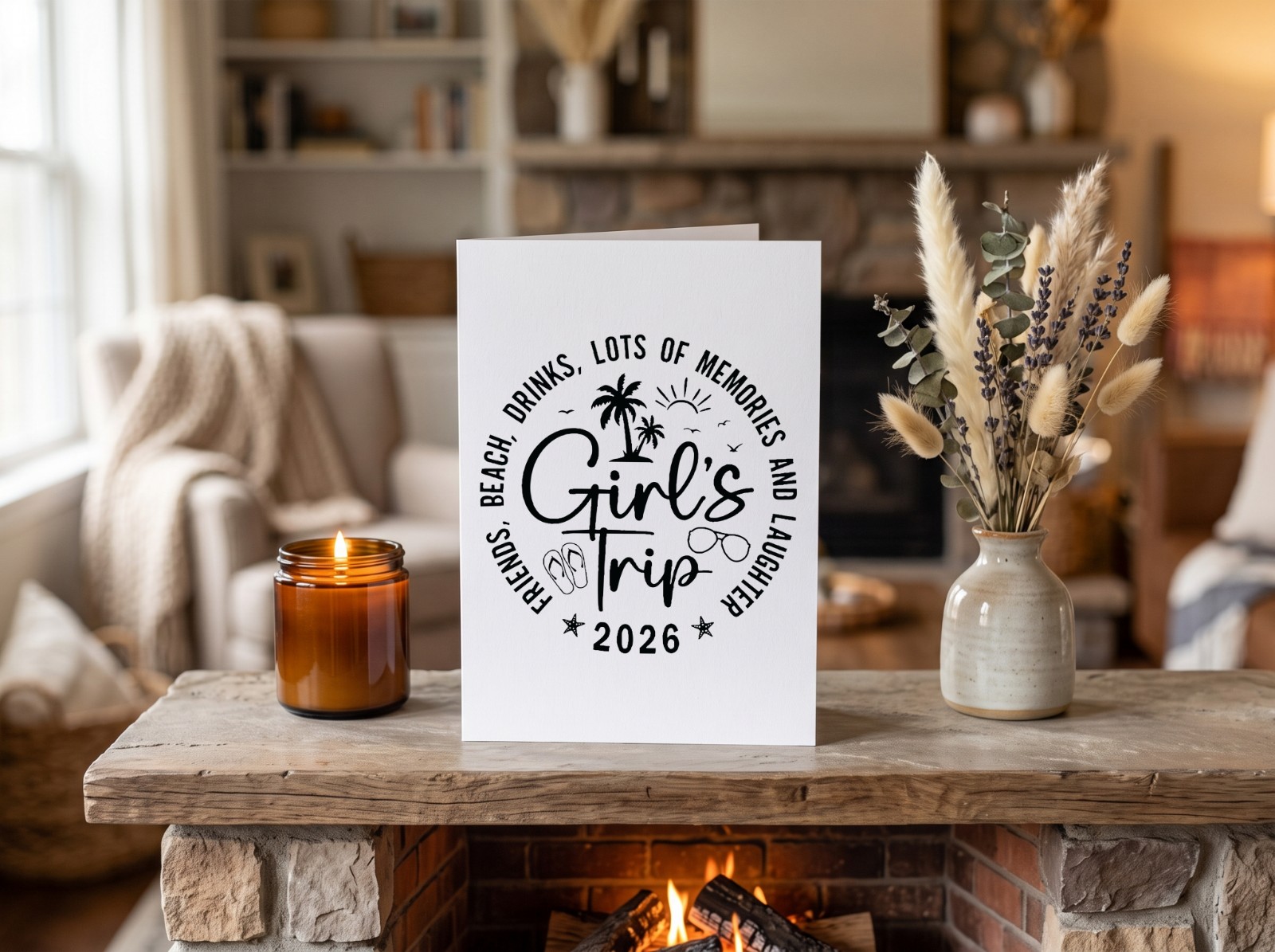 Folded Greeting Card on a Fireplace Mantel showing the Girl's Trip 2026 design
