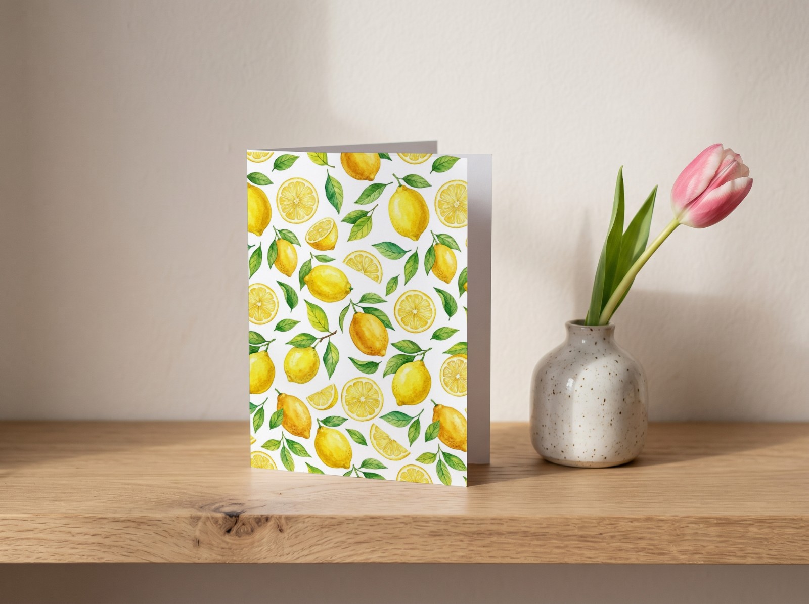 Standing Greeting Card on an Oak Shelf with a Tulip showing a watercolour lemon pattern