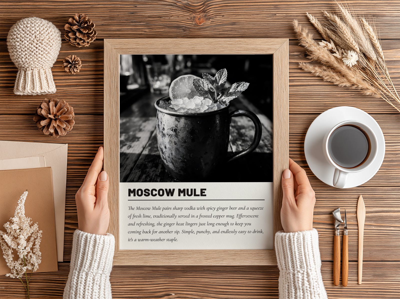 Hands Holding Oak Frame on Wooden Desk showing a Moscow Mule cocktail print