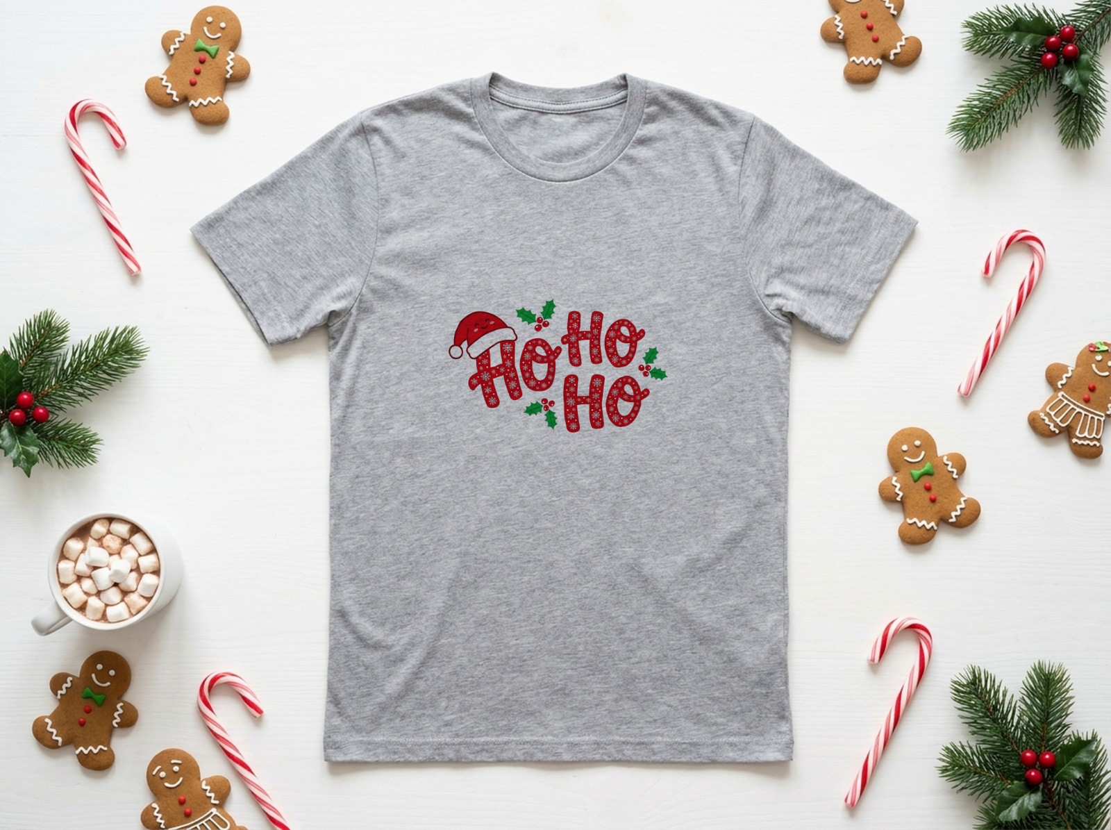 Heather Grey T-Shirt Christmas Flat Lay with Gingerbread and Candy Canes showing a playful Ho Ho Ho design