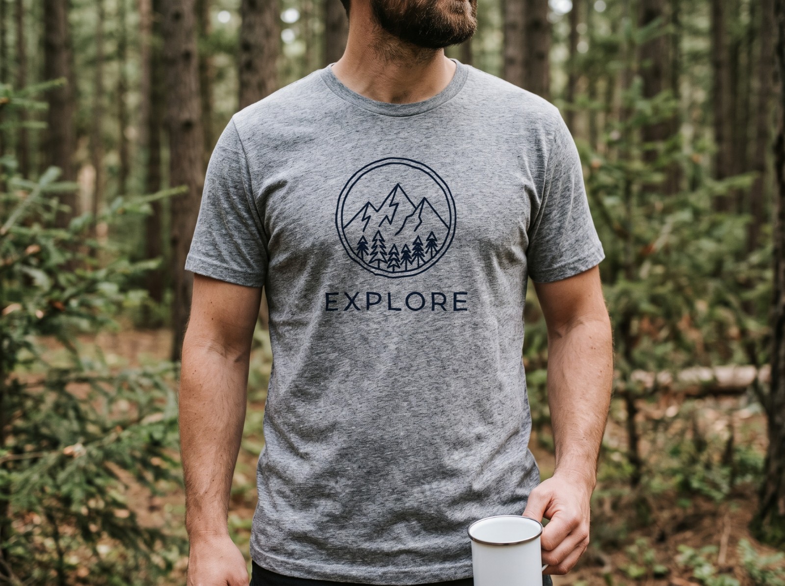 Heather Grey T-Shirt Mockup on a Man in a Pine Forest example