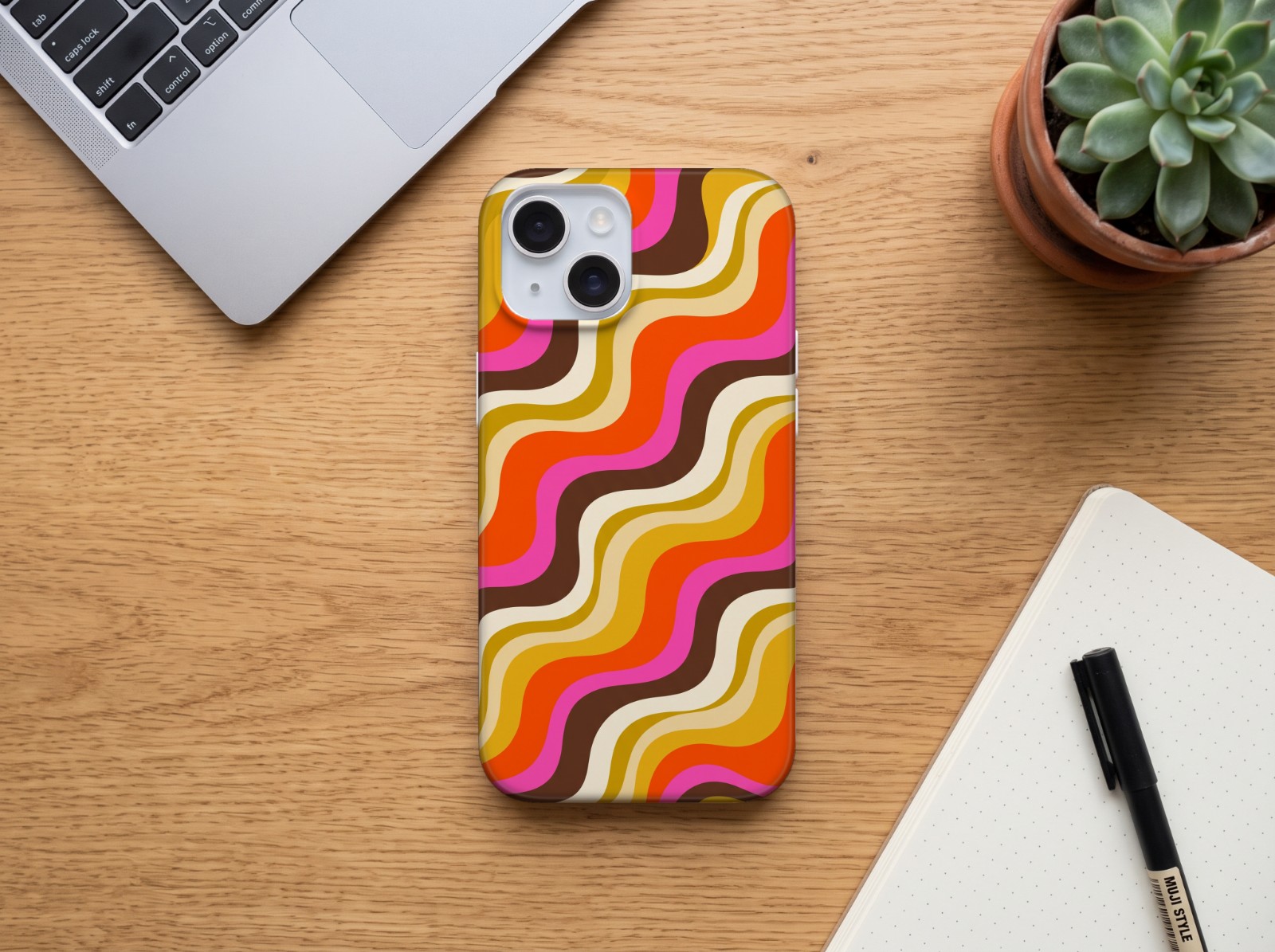 iPhone 15 Case on an Oak Desk (fits iPhone 13 and 14) showing a retro 70s wavy stripe print