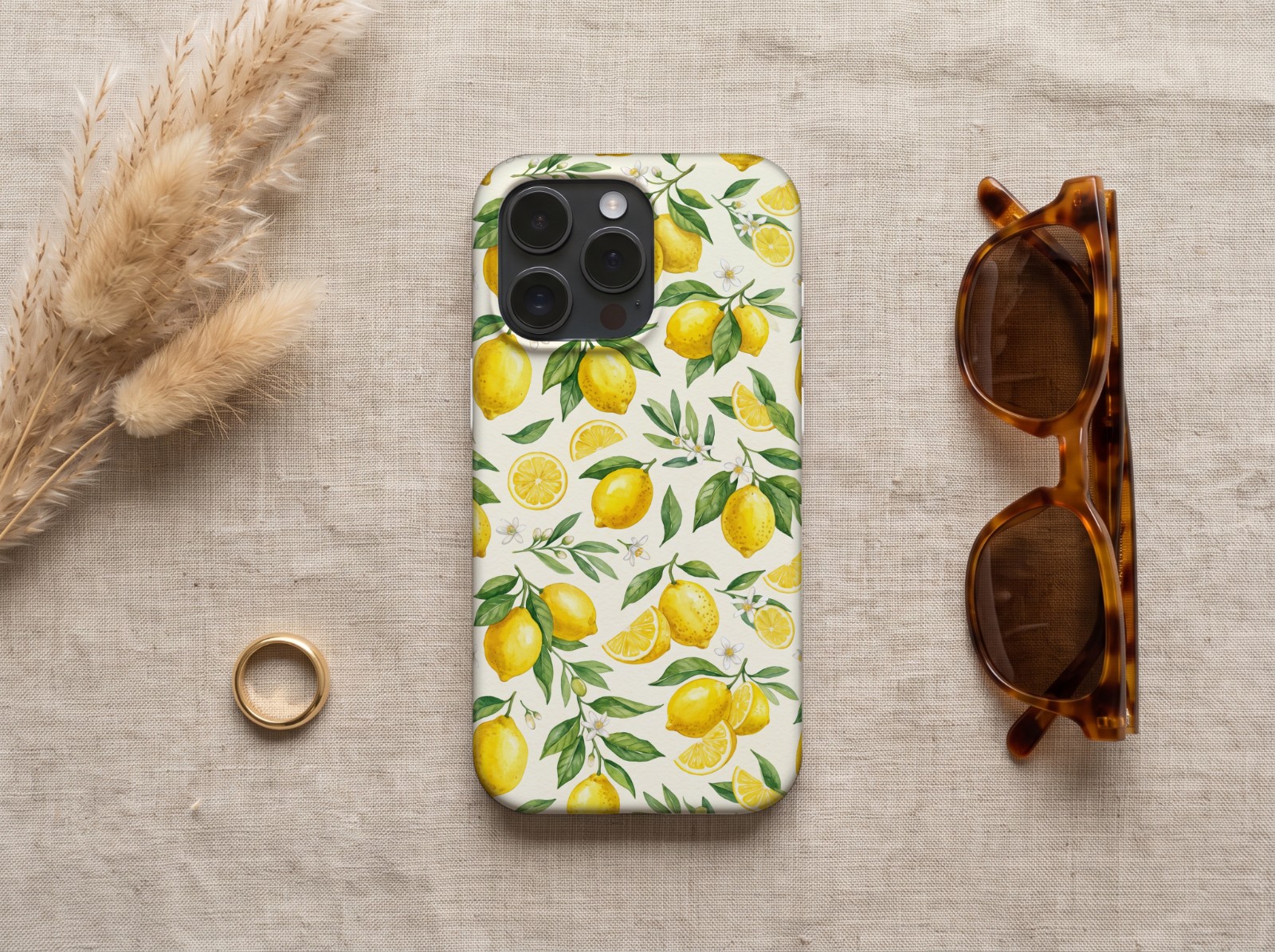 iPhone 16 Pro Case on Linen with Pampas Grass showing a watercolor lemon pattern