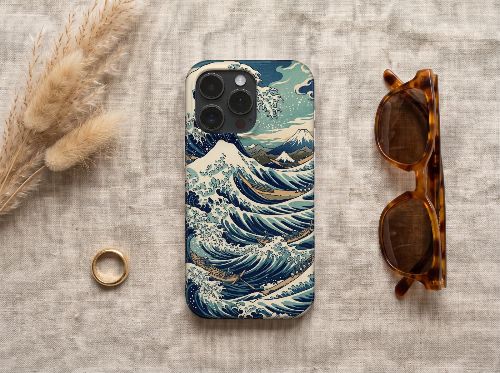 iPhone 16 Pro Case on Linen with Pampas Grass showing a Japanese great wave print