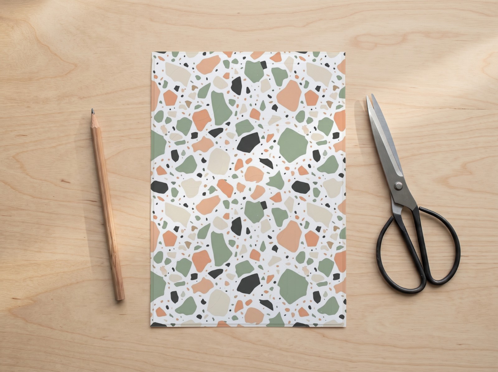 Kiss Cut Sticker Sheet on a Wooden Desk showing a pastel terrazzo pattern