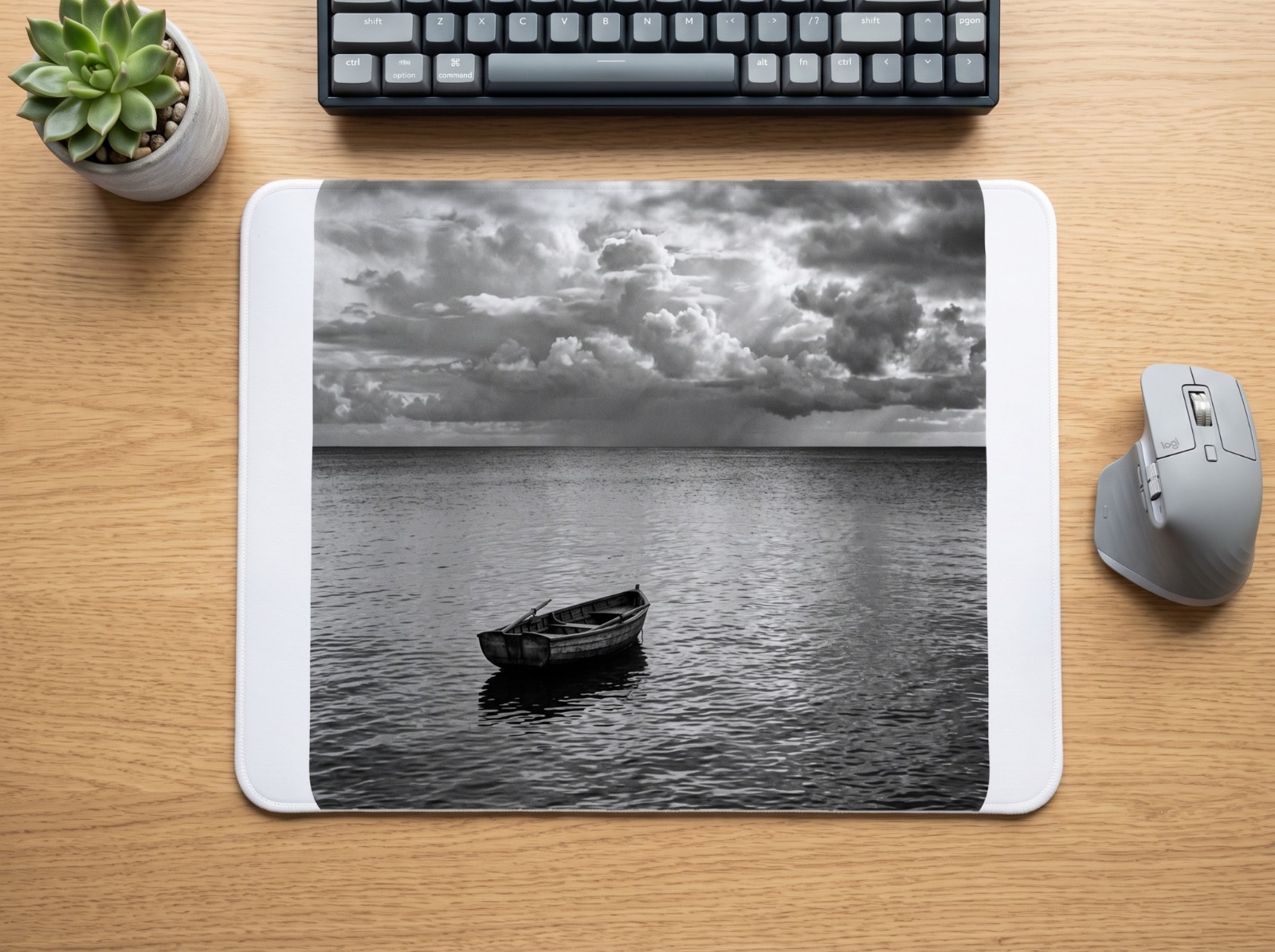 Mouse Pad on an Oak Desk with Keyboard showing a Let Yourself Drift sea photo