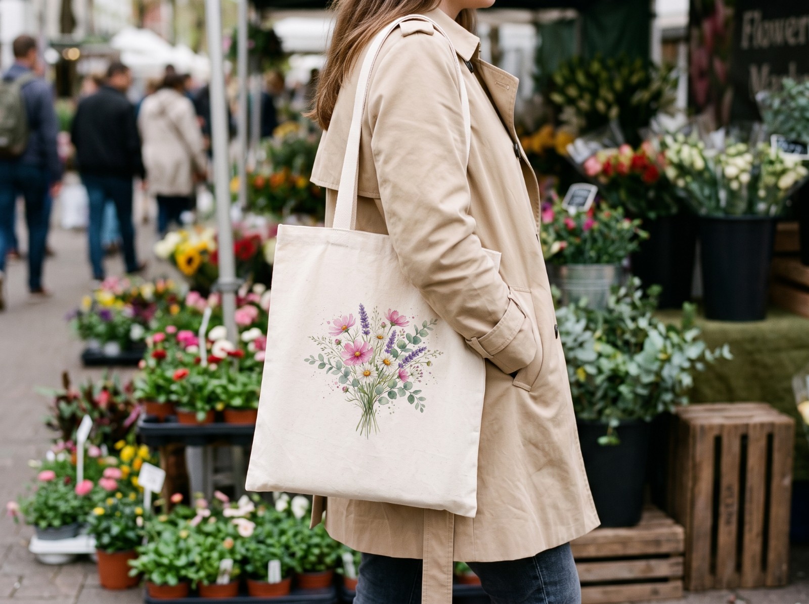 Natural Tote Bag Mockup on a Woman's Shoulder at a Flower Market example