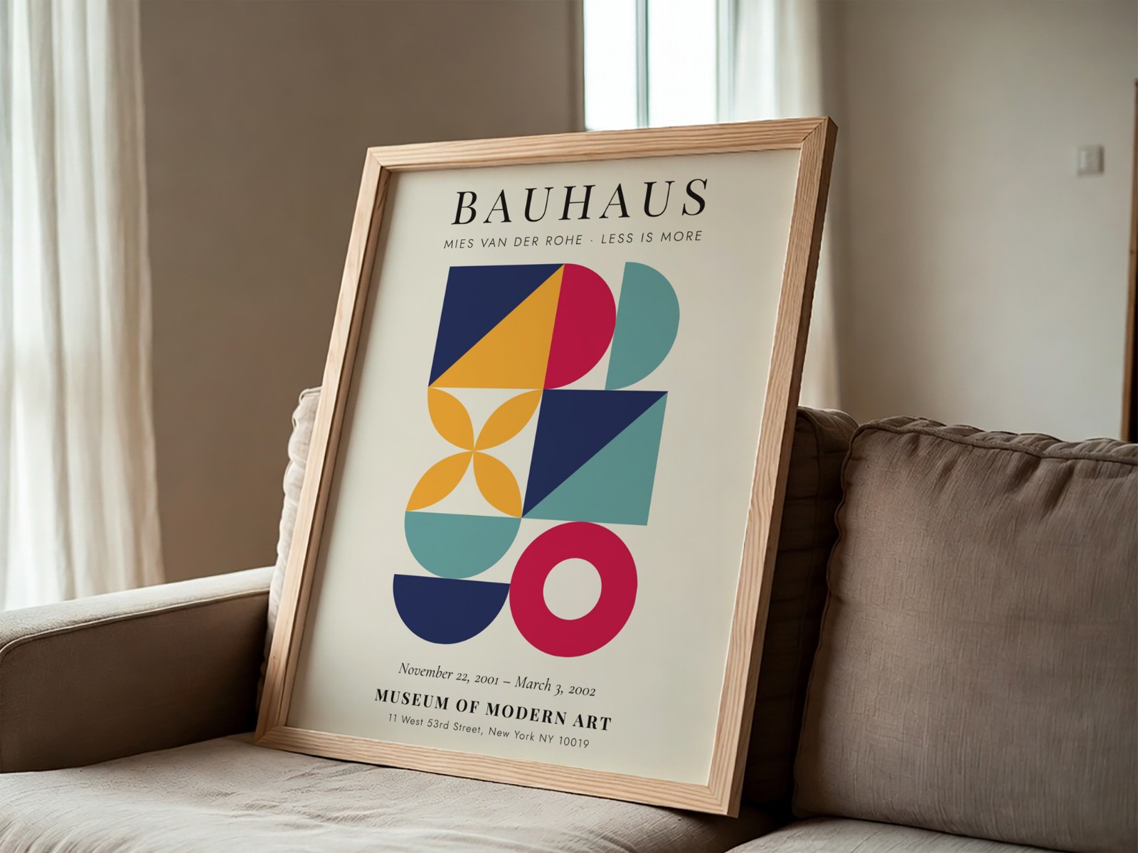 Oak Frame Leaning on Grey Sofa showing a Bauhaus geometric print