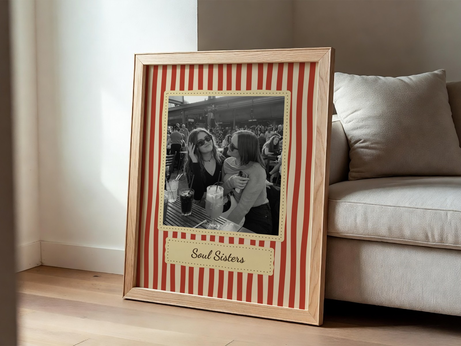 Oak Frame Leaning on Beige Sofa showing a retro Soul Sisters print