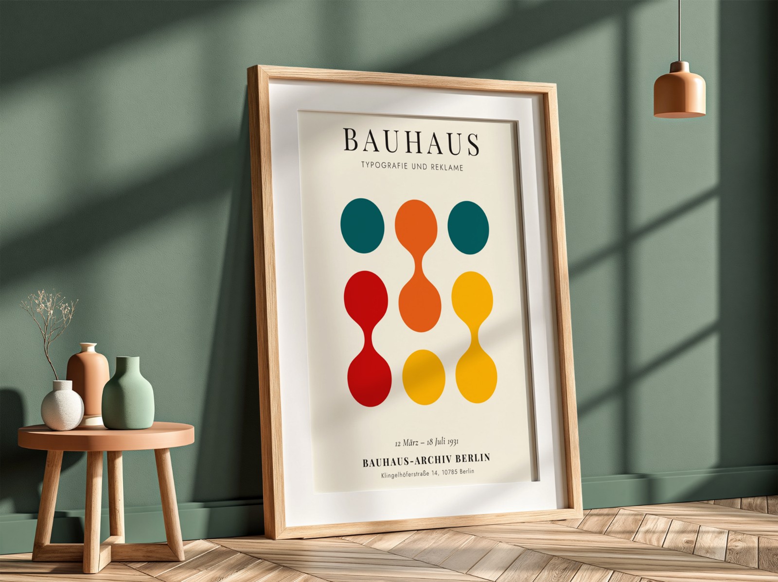 Oak Frame with Mat on Sage Green Wall showing a Bauhaus circles print
