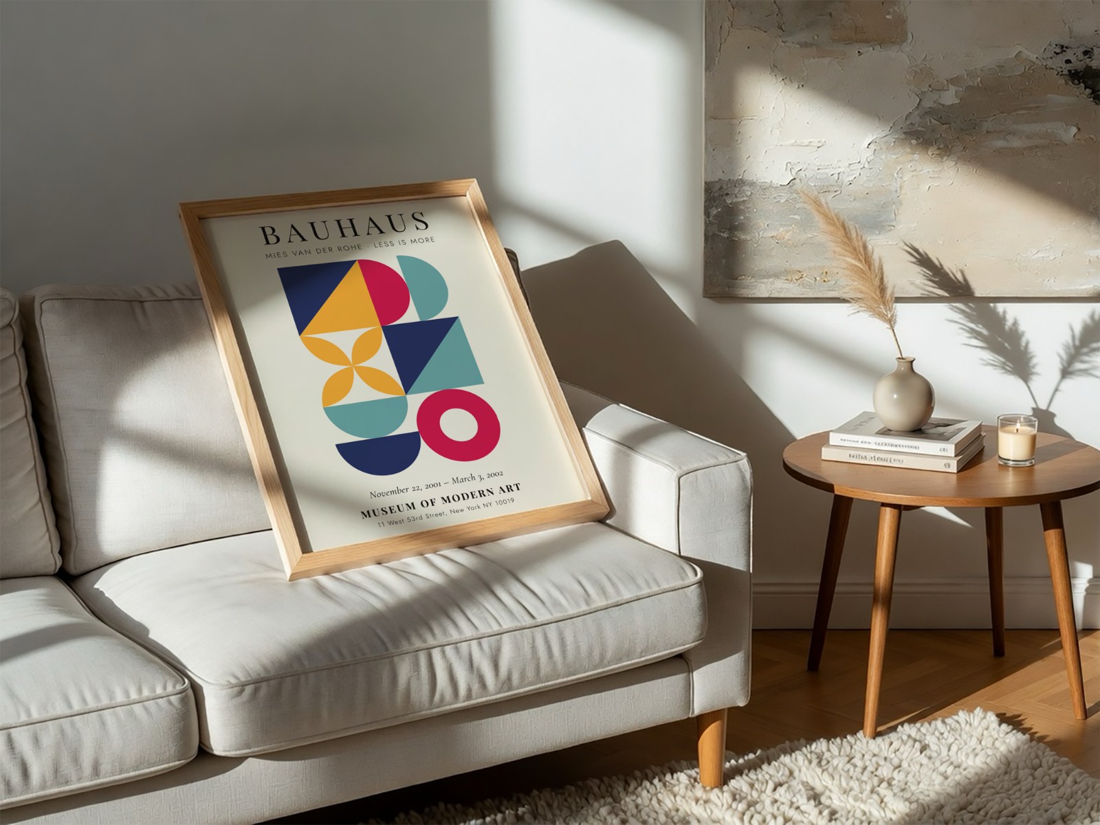 Oak Frame Resting on White Sofa showing a Bauhaus geometric print