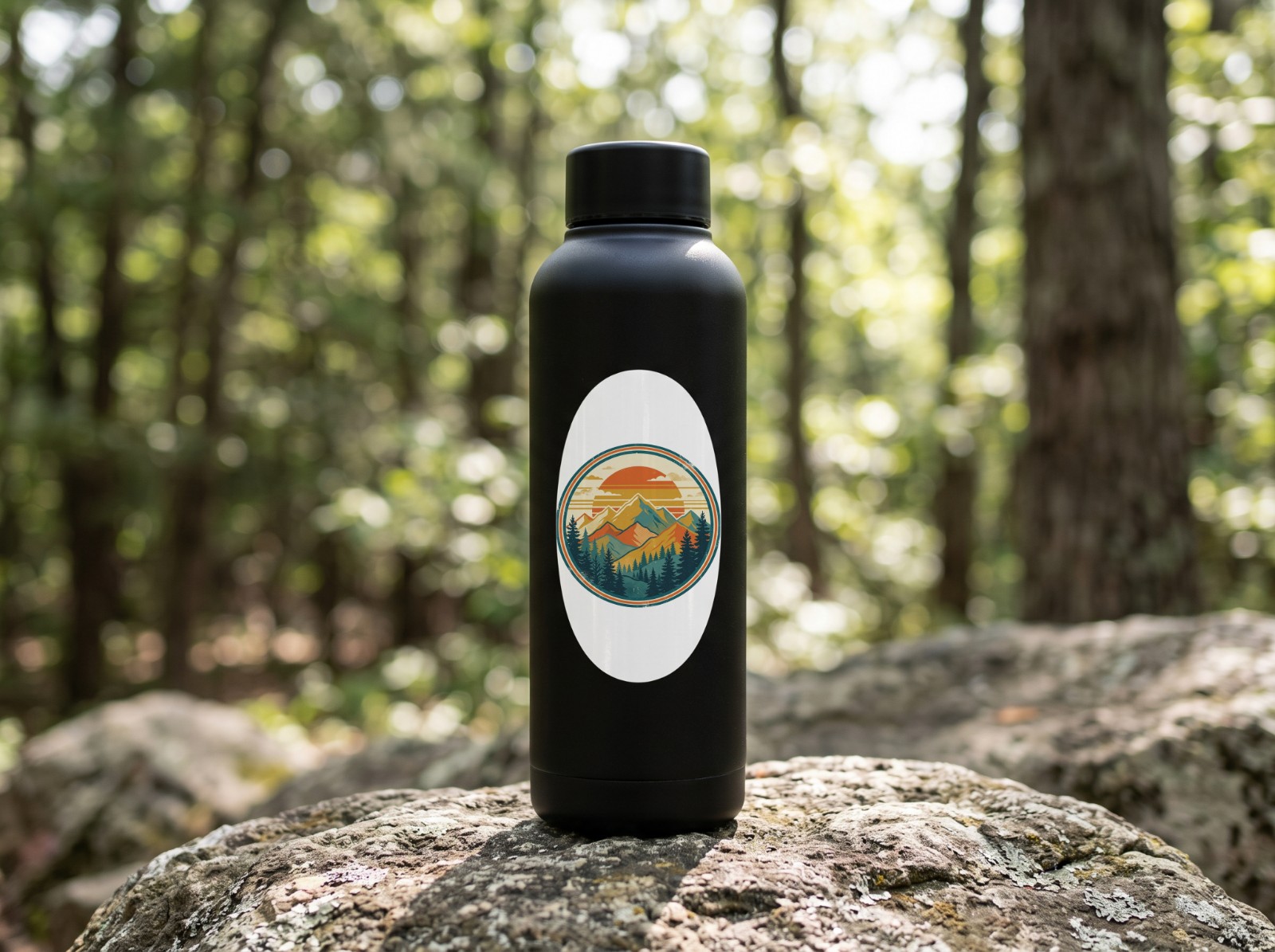 Oval Vinyl Sticker Mockup on a Black Water Bottle in a Forest example