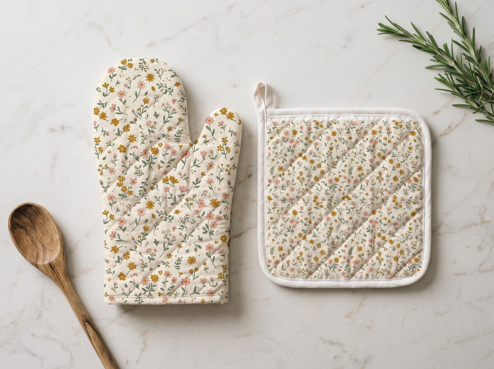 Oven Mitt and Pot Holder Set on a Marble Counter showing a ditsy wildflower pattern