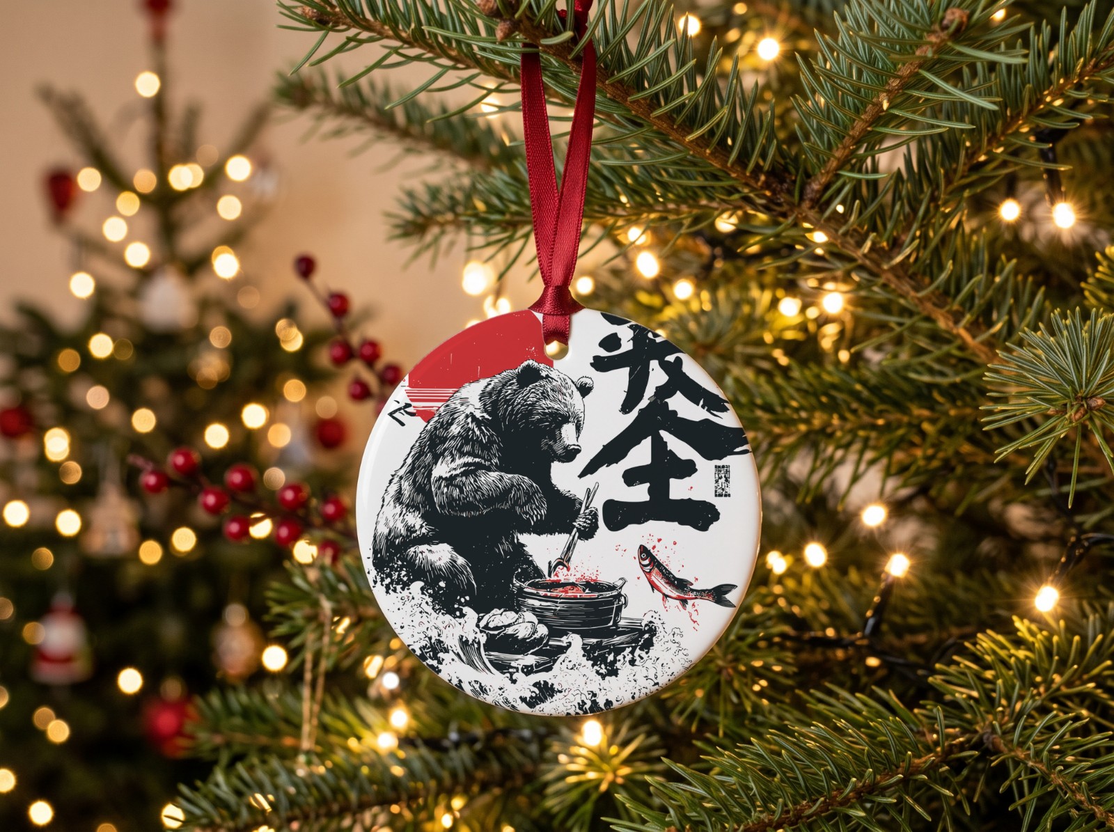 Round Ceramic Ornament Hanging on a Christmas Tree showing the Japanese bear design
