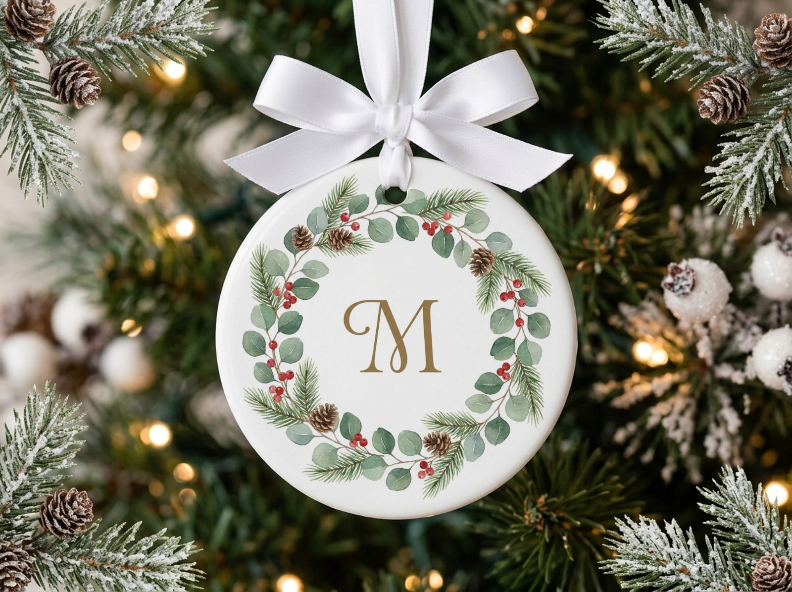 Round Ceramic Ornament Mockup with a White Satin Bow on a Frosted Tree example