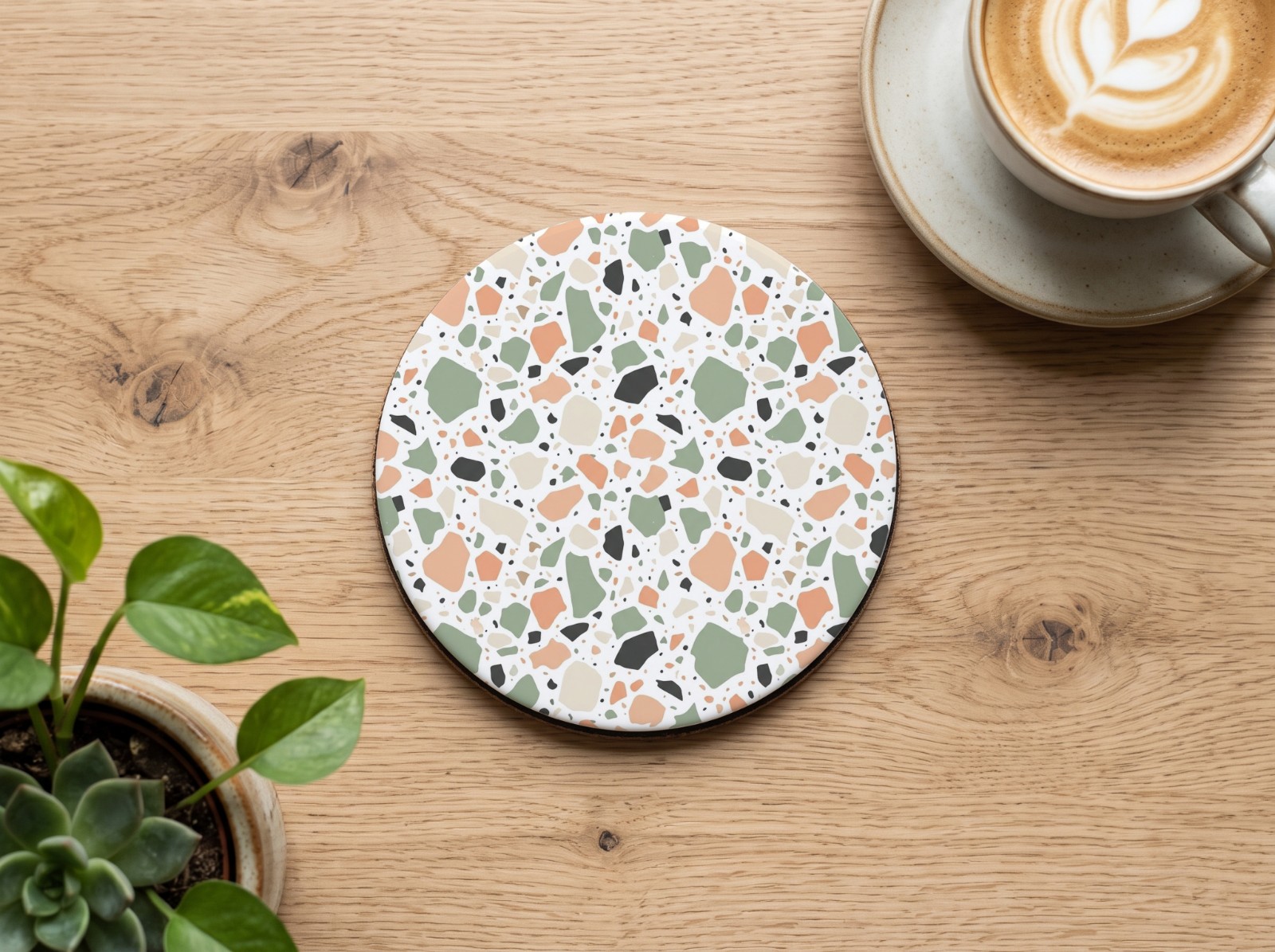 Round White Coaster on an Oak Coffee Table showing a pastel terrazzo pattern