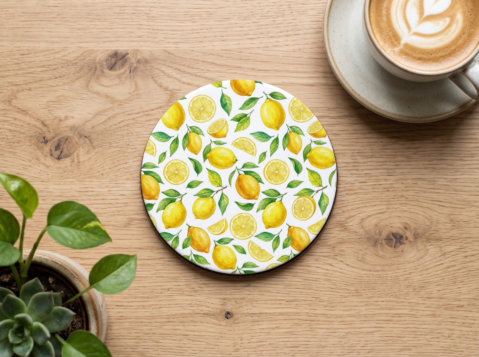 Round White Coaster on an Oak Coffee Table showing a watercolour lemon pattern