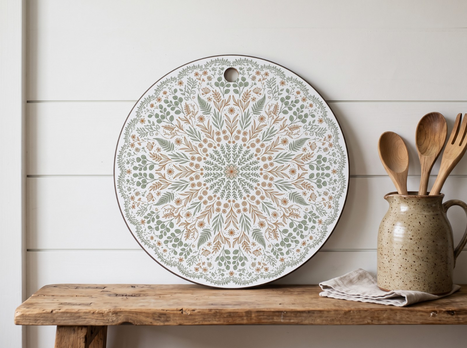 Round White Cutting Board on a Farmhouse Shelf showing a botanical mandala