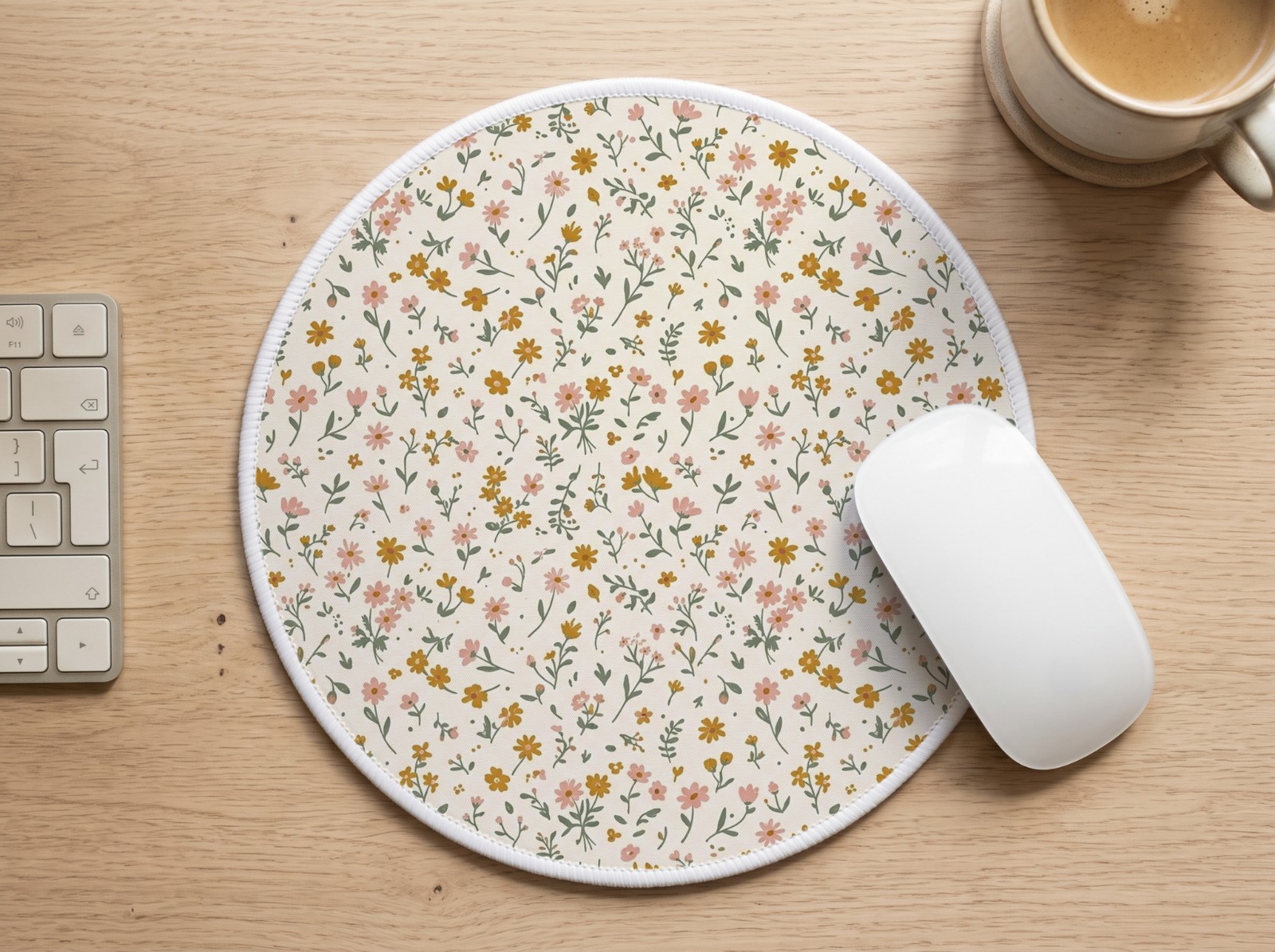 Round White Mouse Pad on an Oak Desk showing a ditsy wildflower pattern