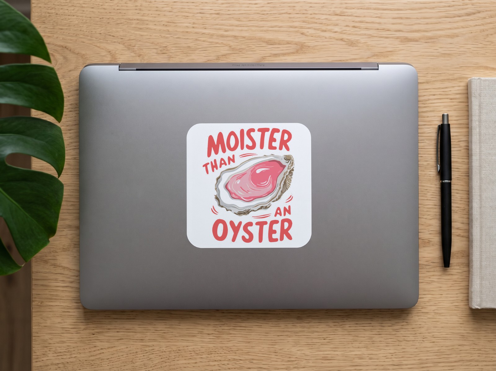 Square Vinyl Sticker on a Laptop Lid showing the Moister Than an Oyster design