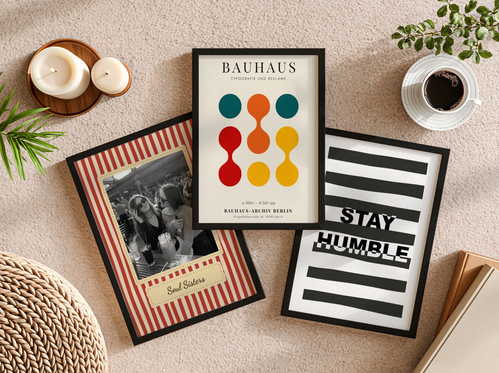 Three Black Frames Flat Lay on Beige Carpet showing a Bauhaus circles print, a Stay Humble typography print and 1 more design