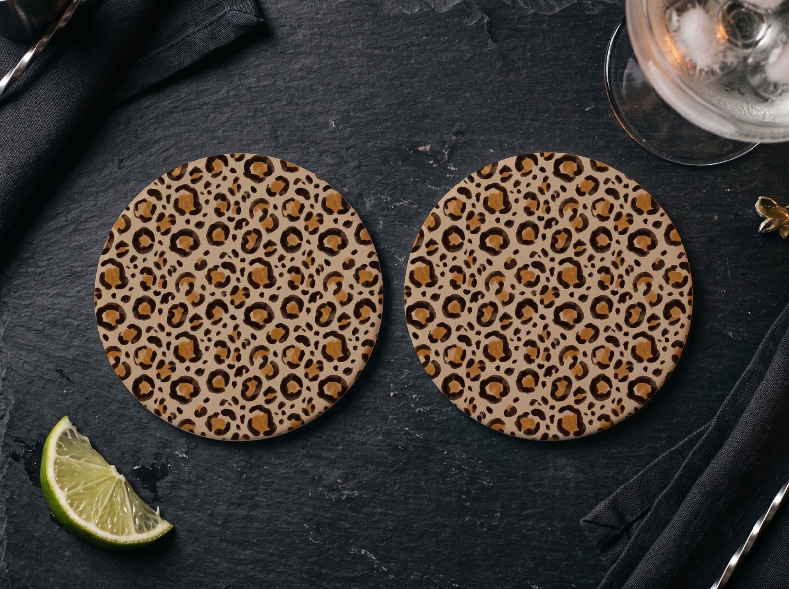 Two Round White Coasters on a Slate Bar showing a neutral leopard print
