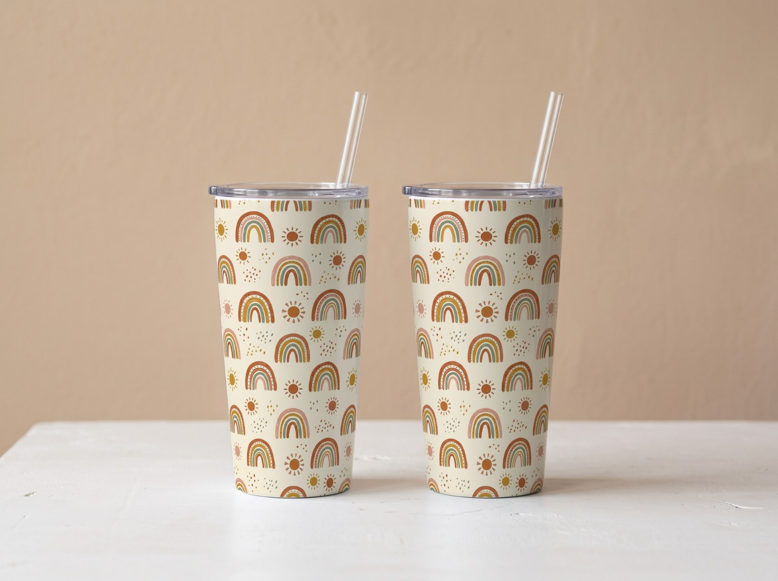 Two Tapered Tumblers Against a Beige Wall showing a boho rainbow pattern