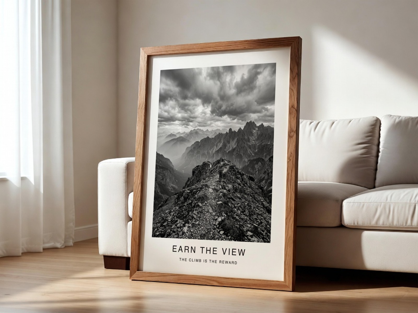 Walnut Frame Leaning by White Sofa showing a black and white mountain print