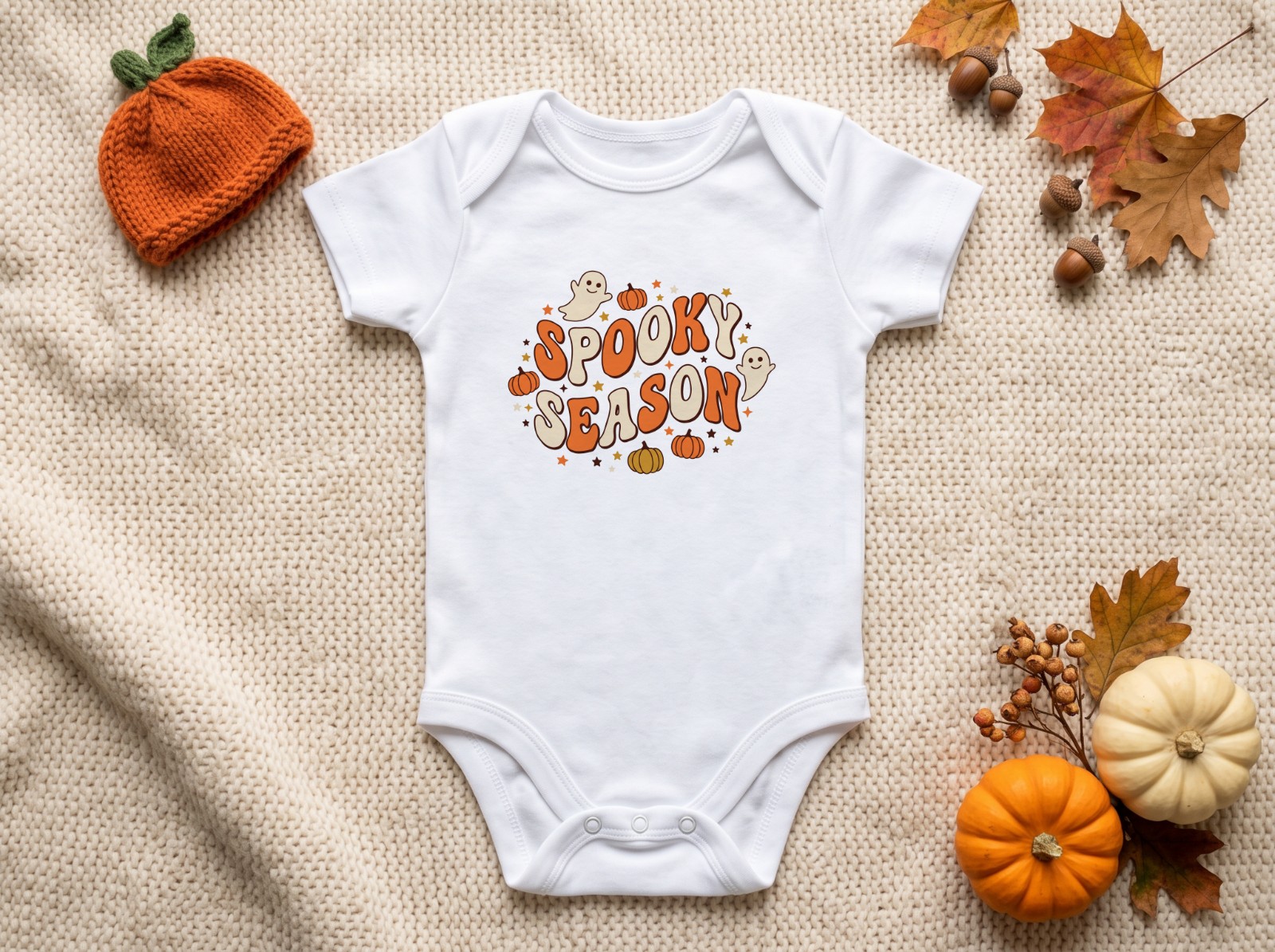 White Baby Onesie Halloween with a Knit Pumpkin Hat showing a groovy retro Spooky Season design