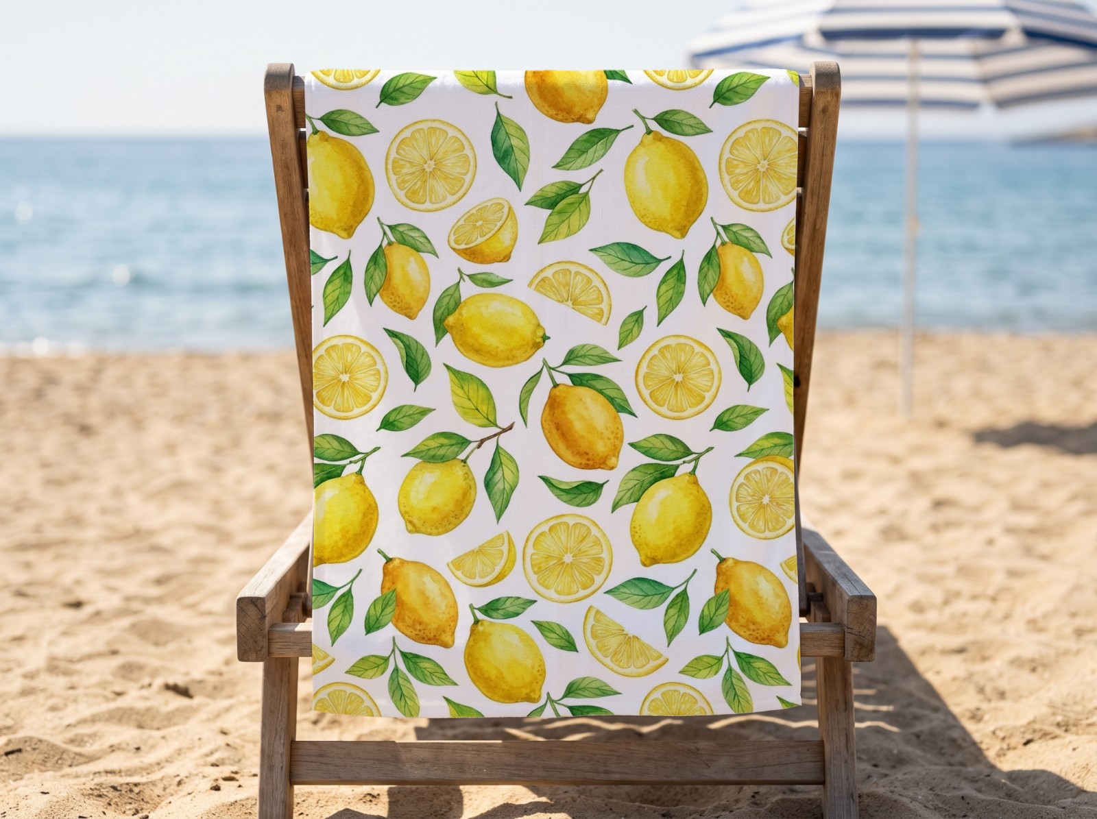 White Beach Towel on a Wooden Beach Chair showing a watercolour lemon pattern