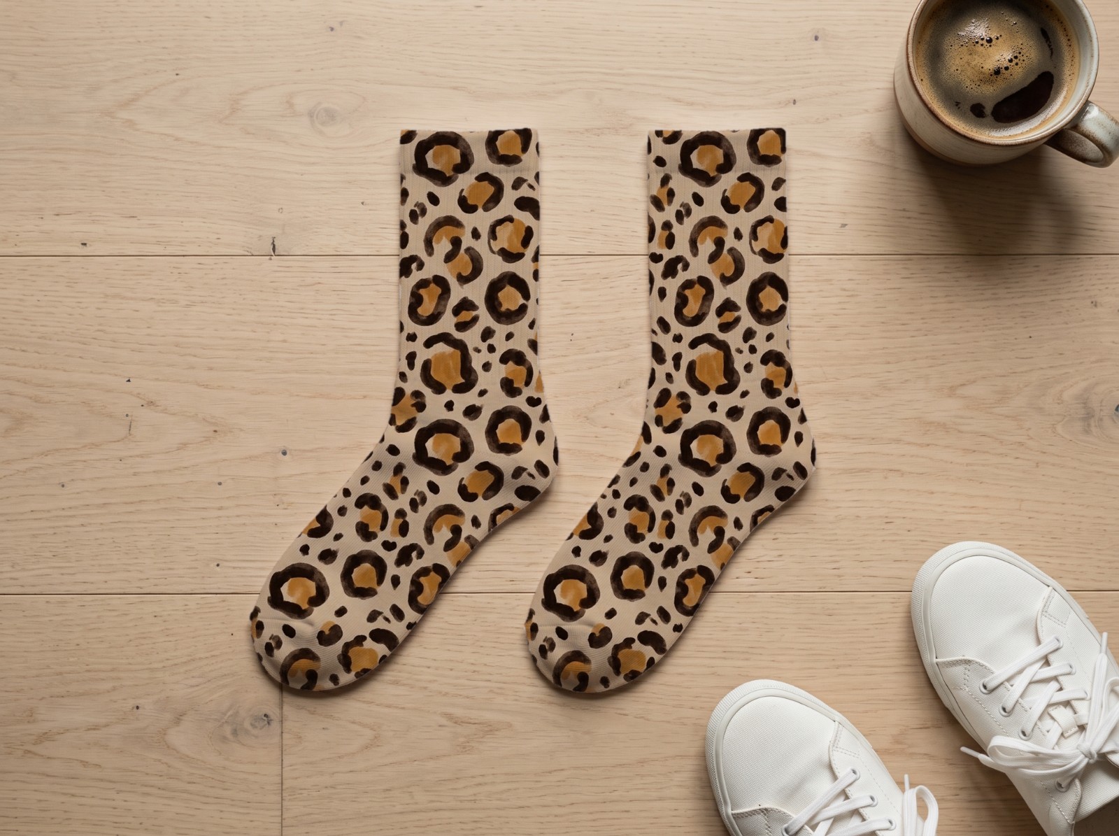White Crew Socks Pair Flat Lay on a Wood Floor showing a neutral leopard print