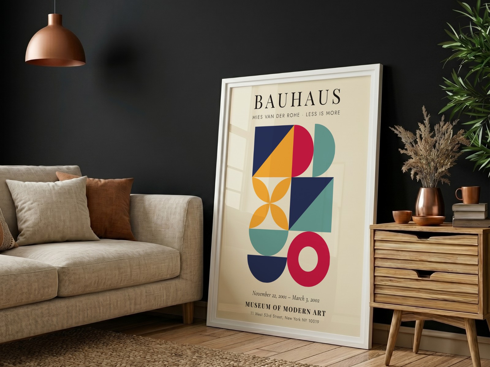 White Frame on Black Wall with Sofa showing a Bauhaus geometric print