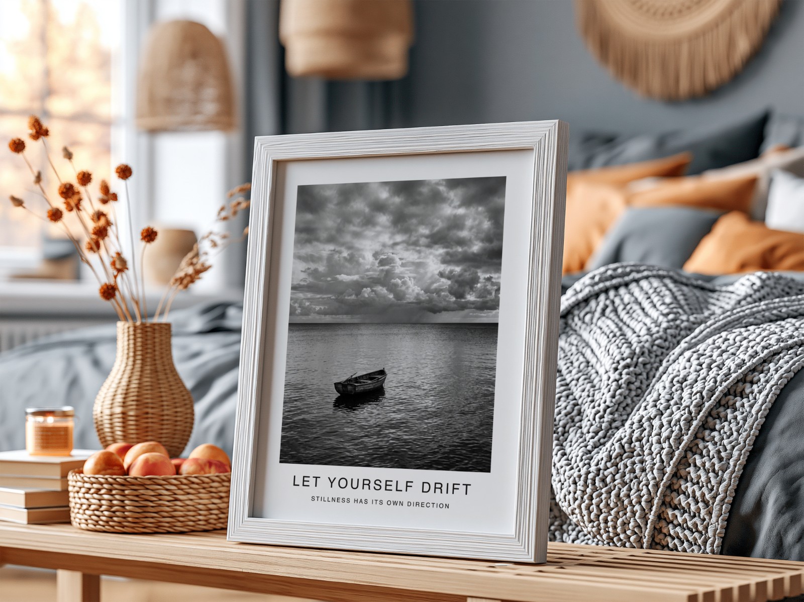 White Frame on Table in Cosy Bedroom showing a black and white seascape print